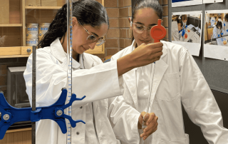 A photo of two students from Mount St Joseph (MSJ) Milperra experimenting in a science lab